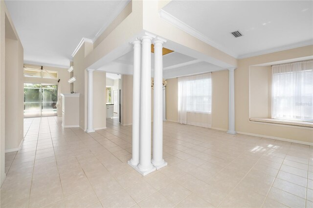 interior space with decorative columns and crown molding