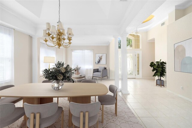 dining space featuring decorative columns, a chandelier, a healthy amount of sunlight, and light tile patterned floors