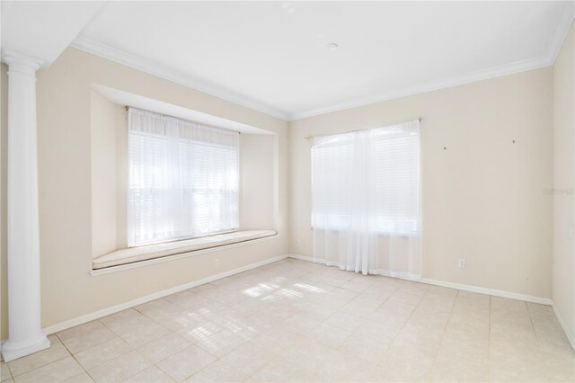 tiled empty room with crown molding and decorative columns