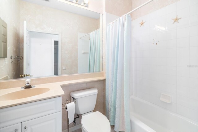 full bathroom with vanity, toilet, and shower / bath combination with curtain