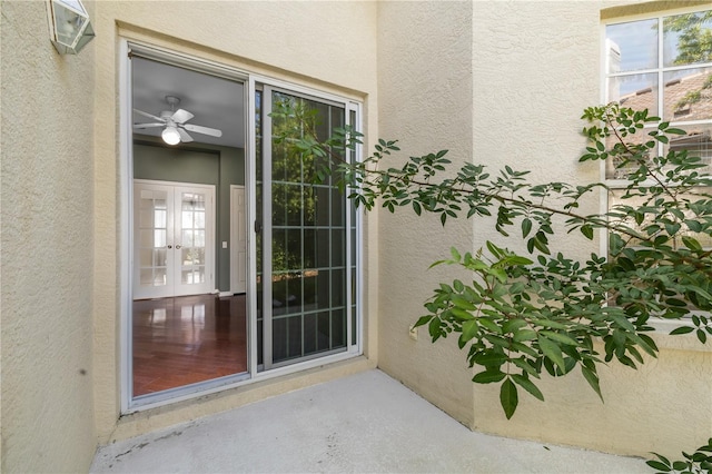 property entrance featuring french doors