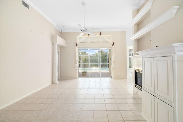 unfurnished living room with light tile patterned flooring, ceiling fan, and crown molding