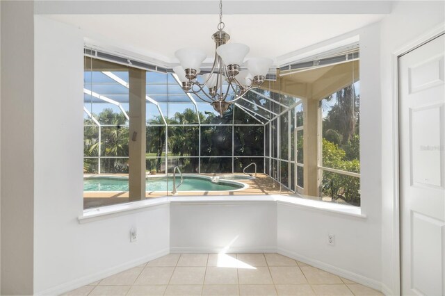 unfurnished dining area featuring a wealth of natural light, light tile patterned floors, and an inviting chandelier