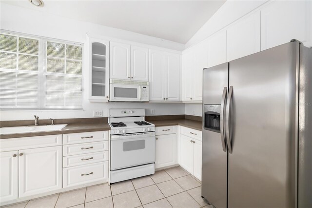 kitchen with white cabinetry, vaulted ceiling, white appliances, and sink