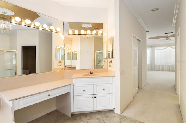 bathroom with vanity, crown molding, ceiling fan with notable chandelier, and tile patterned floors