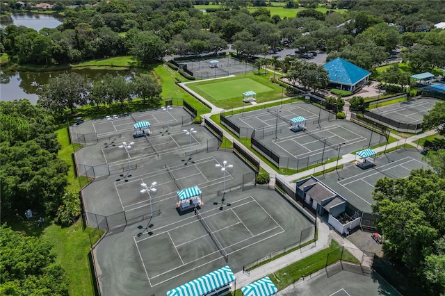 birds eye view of property with a water view