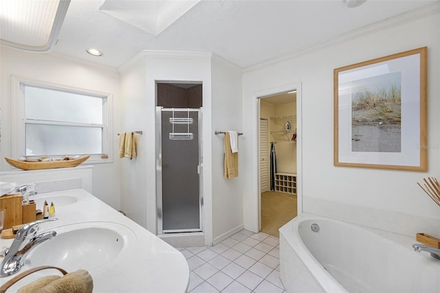 bathroom featuring vanity, tile patterned floors, plus walk in shower, and crown molding