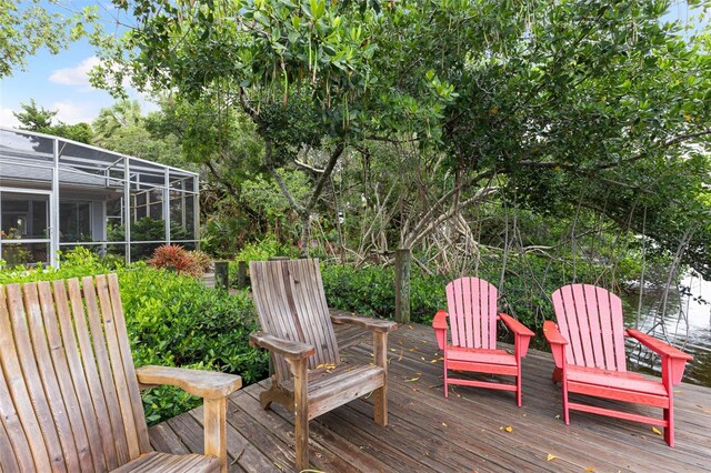 wooden terrace featuring a lanai