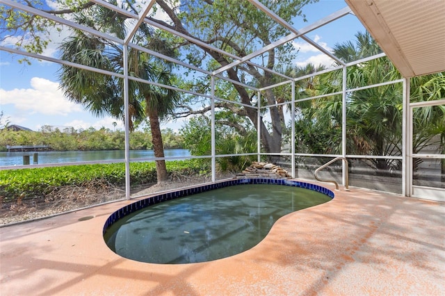 view of swimming pool with a patio area, a water view, and a lanai