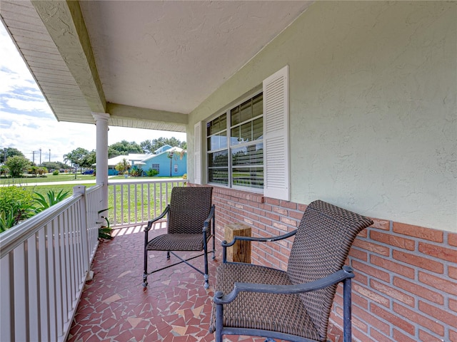 balcony featuring covered porch