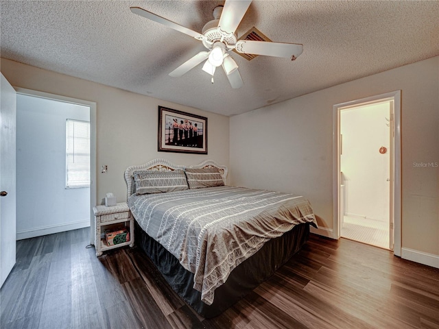 bedroom featuring hardwood / wood-style flooring, a textured ceiling, and ceiling fan