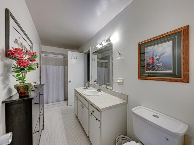 bathroom with tile patterned floors, toilet, and vanity