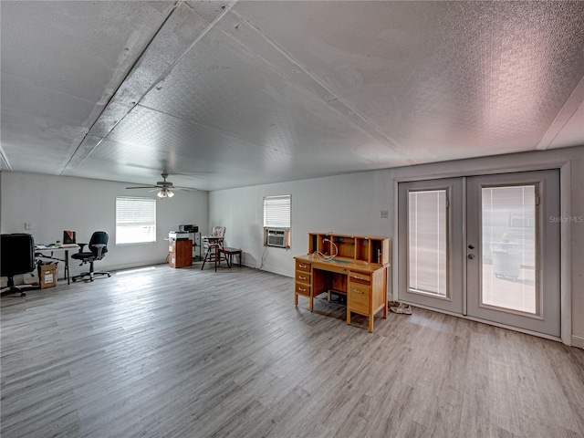 misc room with french doors, ceiling fan, and light wood-type flooring