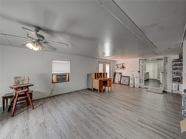 sitting room with cooling unit, french doors, ceiling fan, and light hardwood / wood-style floors