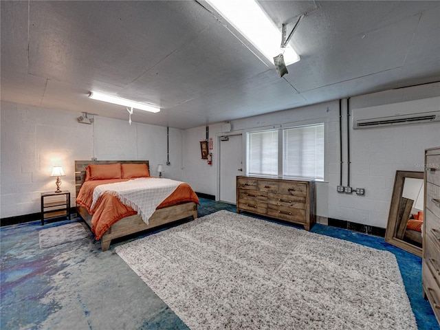 bedroom featuring concrete flooring and a wall unit AC