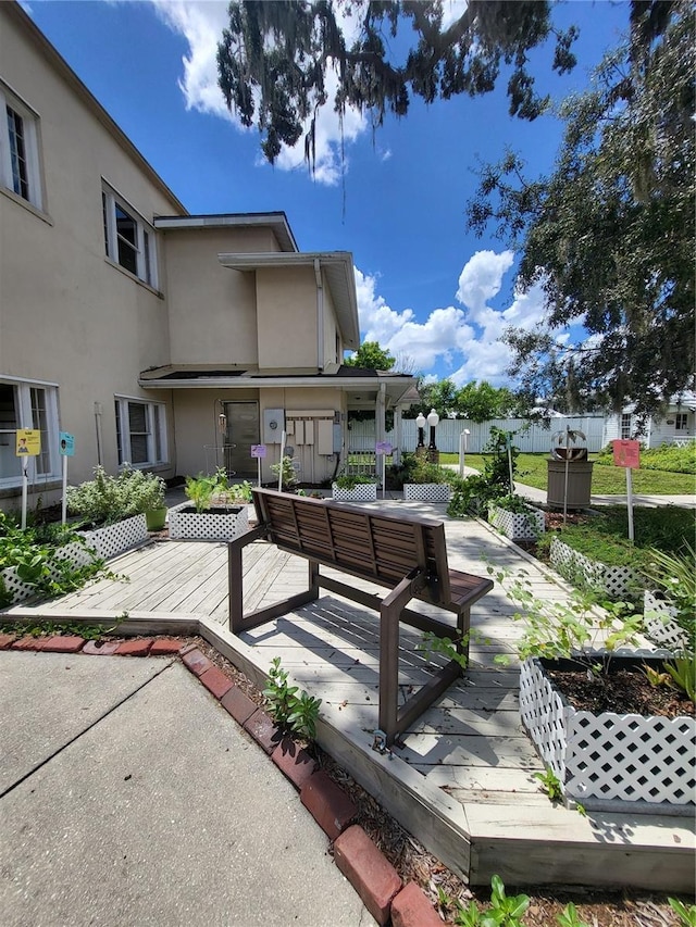 surrounding community with a wooden deck