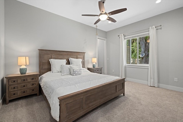 carpeted bedroom featuring ceiling fan