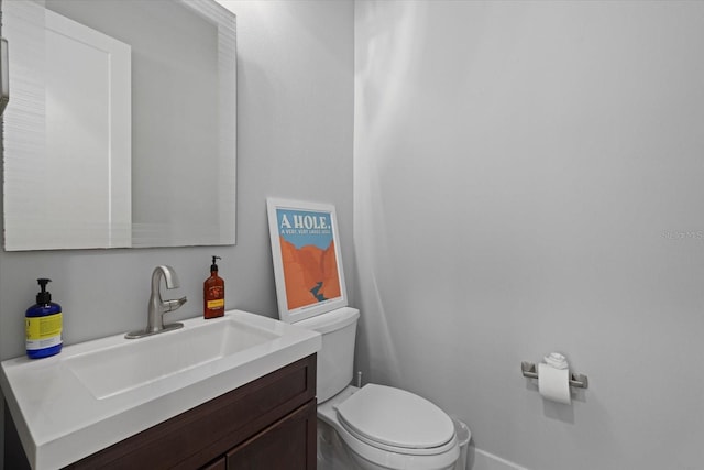 bathroom with toilet and vanity