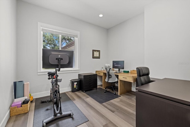 office space with light hardwood / wood-style floors