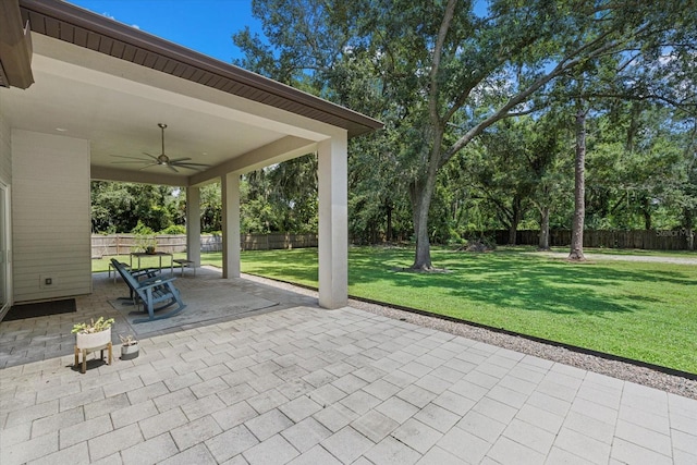 view of patio featuring ceiling fan