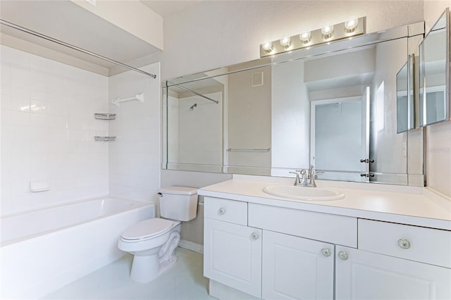 full bathroom with toilet, vanity, and tiled shower / bath