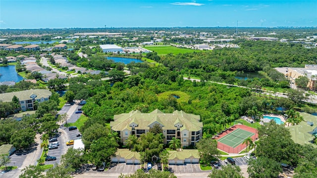 drone / aerial view with a residential view and a water view