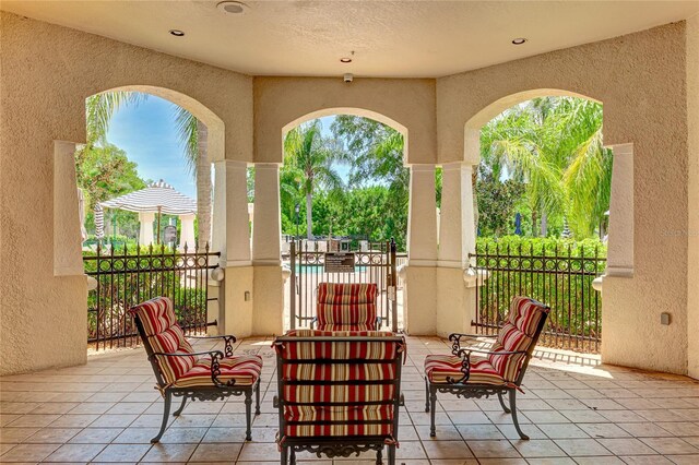 view of patio featuring fence