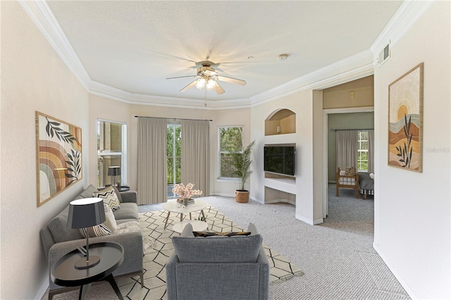 interior space with ceiling fan, plenty of natural light, and crown molding