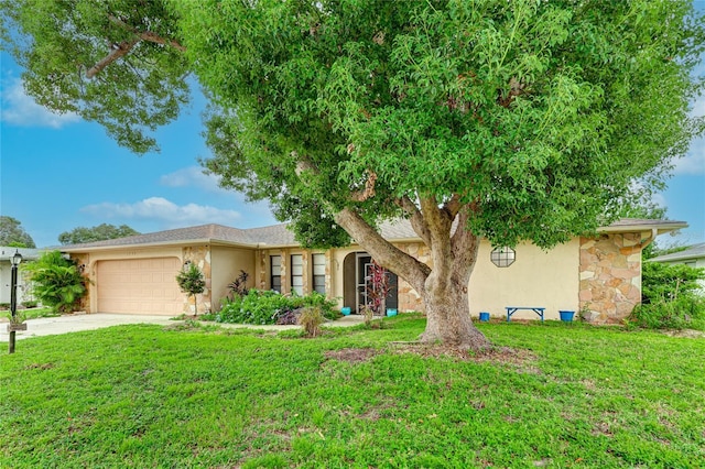 view of front of home featuring a garage and a front yard