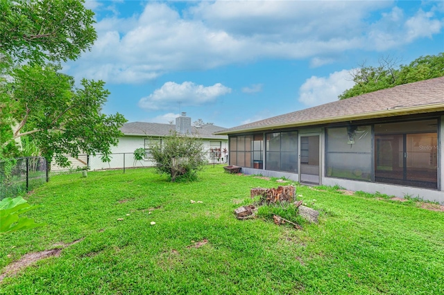 view of yard featuring a sunroom