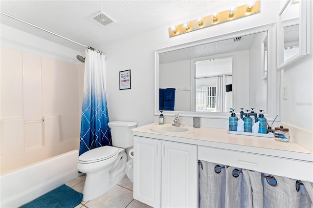 full bathroom featuring shower / bath combo with shower curtain, tile patterned flooring, a textured ceiling, toilet, and vanity