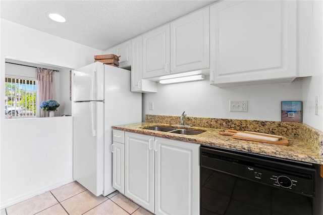 kitchen featuring light tile patterned flooring, white cabinetry, dishwasher, light stone counters, and sink