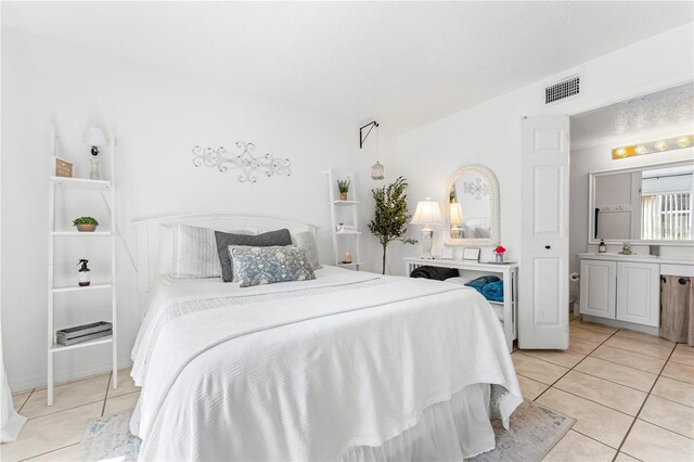 tiled bedroom with sink