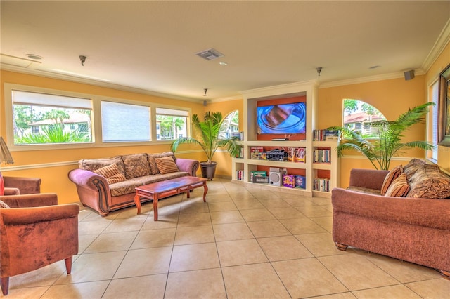 living room with built in shelves, light tile patterned floors, and ornamental molding