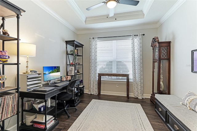 office area featuring crown molding, dark hardwood / wood-style flooring, and a tray ceiling