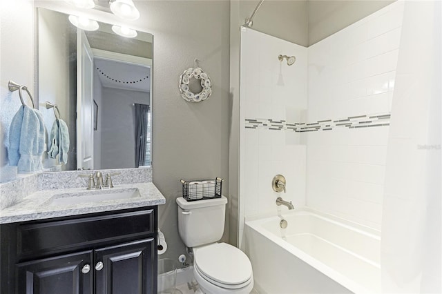 full bathroom with tiled shower / bath combo, vanity, and toilet