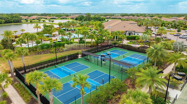 birds eye view of property with a water view