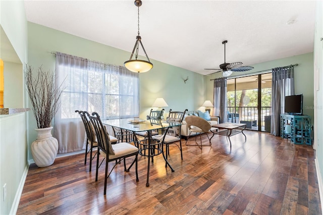 dining area featuring dark hardwood / wood-style floors and ceiling fan