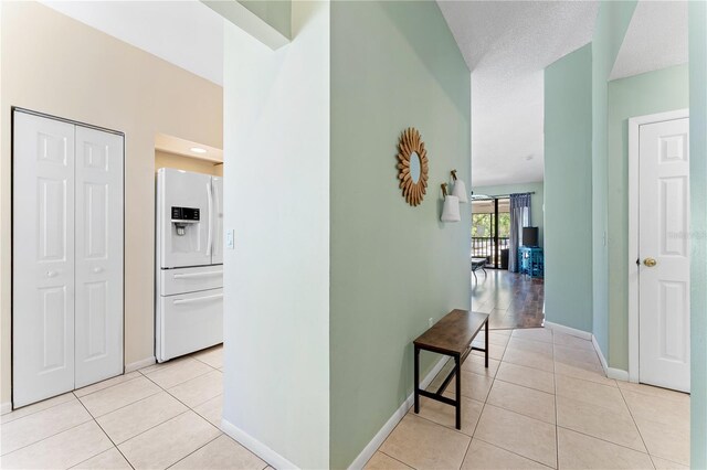 corridor with light hardwood / wood-style flooring