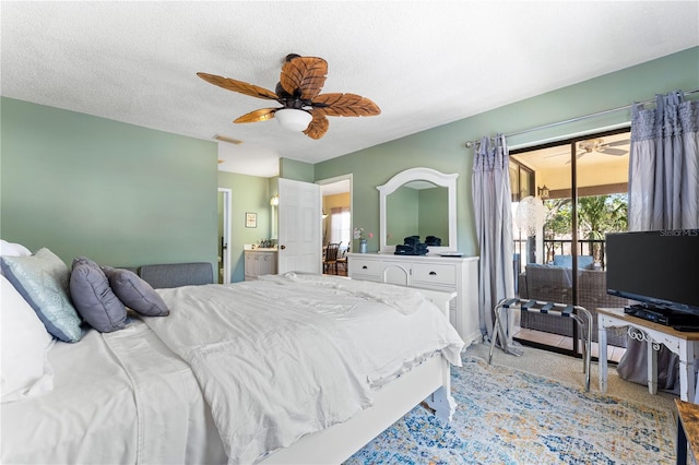 carpeted bedroom featuring a textured ceiling, access to outside, and ceiling fan