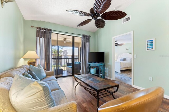 living room featuring ceiling fan and wood-type flooring