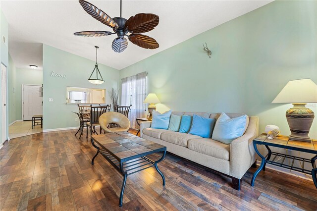 living room with wood-type flooring and ceiling fan