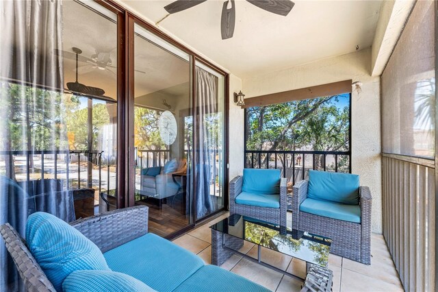 sunroom / solarium with ceiling fan and a healthy amount of sunlight