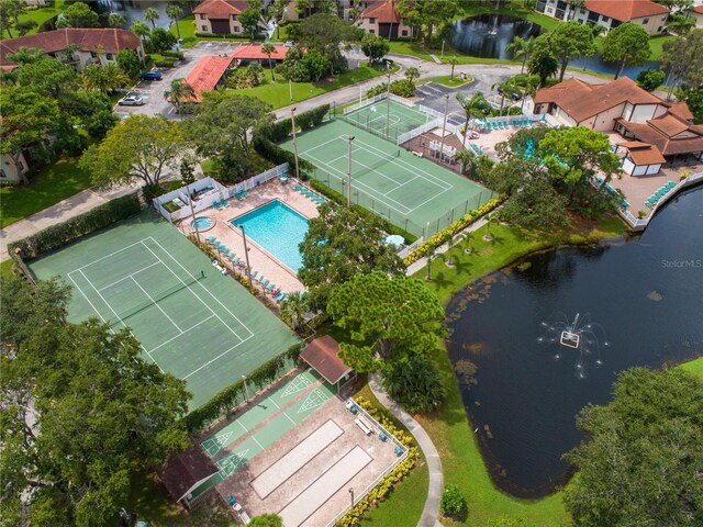 birds eye view of property with a water view