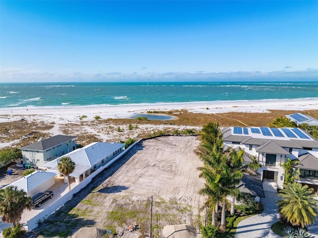 drone / aerial view with a view of the beach and a water view