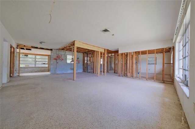 unfurnished living room with plenty of natural light