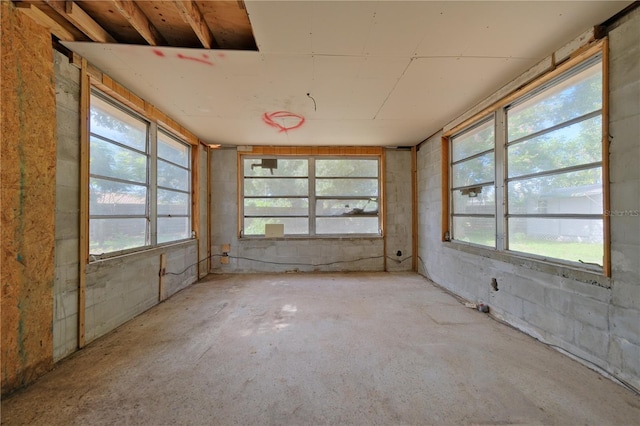 unfurnished sunroom with a healthy amount of sunlight