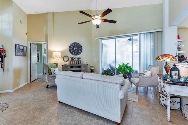 living room featuring ceiling fan, high vaulted ceiling, and light tile patterned floors