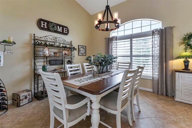 dining room with high vaulted ceiling, a notable chandelier, and light tile patterned floors