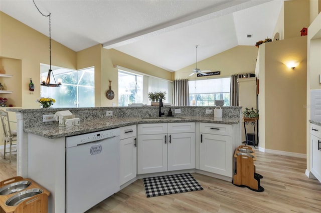 kitchen with dishwasher, light hardwood / wood-style flooring, sink, ceiling fan, and vaulted ceiling